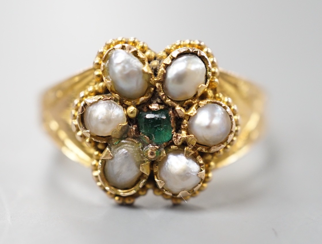 A late Victorian gold, emerald and split pearl cluster set ring, with later engraved inscription, size N, gross weight 2.9 grams.